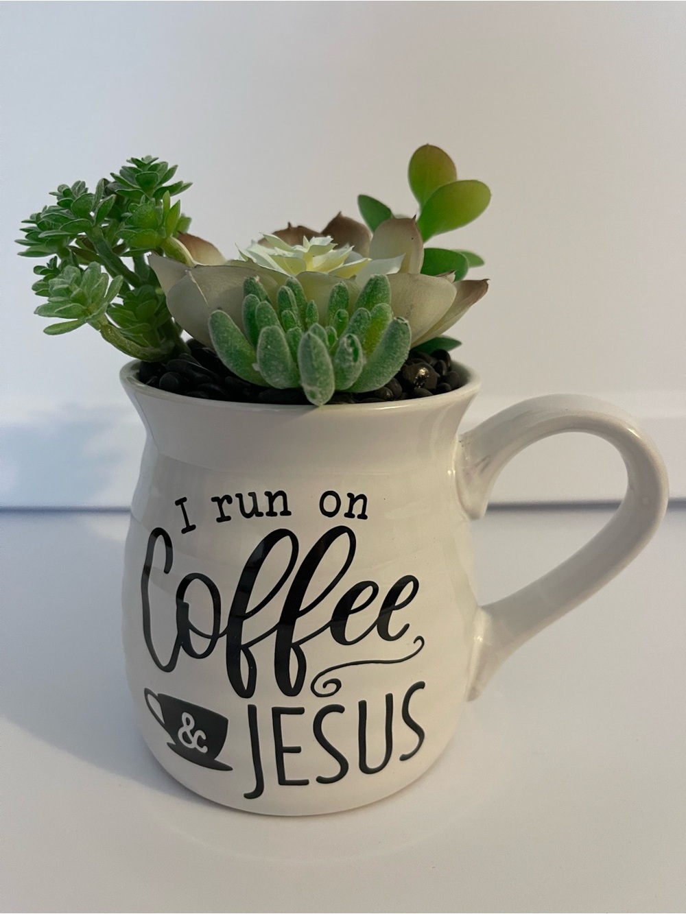White Ceramic 'I Run on Coffee & Jesus' Mug Planter with Green Faux Succulents